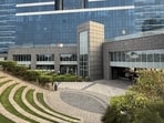 What is more beneficial to the environment — small lawns with a few trees attached to each factory building or large uninterrupted stretches of forest? (Shutterstock)