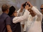 Bihar CM Nitish Kumar resisted with a smile and both hands as a Muslim community leader offered to put a cap on his head, at the state madrasa education board's function in Patna. Bihar CM Nitish Kumar resisted with a smile and both hands as a Muslim community leader offered to put a cap on his head, at the state madrasa education board's function in Patna.
