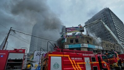 Broken glass from nearby shop windows littered the road as panicked residents rushed from the scene, witnesses said. (AP/PTI)