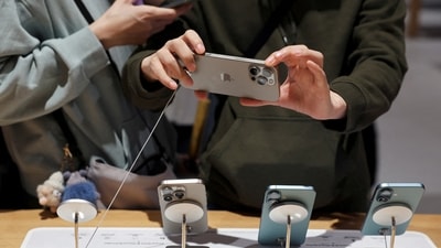 A man checks an iPhone 16 Pro Max as the new iPhone 16 series smartphones go on sale at an Apple store in Beijing, China September 20, 2024. REUTERS//File Photo (Florence Lo/Reuters)