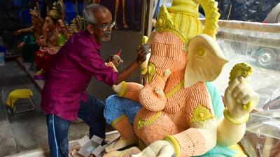 An artist uses coloured chalk sticks to make Ganpati idol, at a Ganesh workshop, Chinchpokli, in Mumbai, India, on Thursday. (Bhushan Koyande/HT Photo) An artist uses coloured chalk sticks to make Ganpati idol, at a Ganesh workshop, Chinchpokli, in Mumbai, India, on Thursday. (Bhushan Koyande/HT Photo)