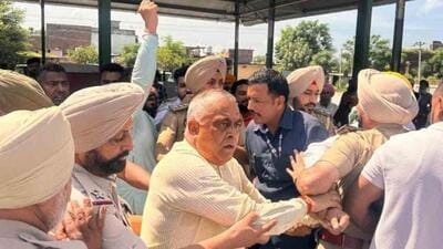 BJP leader KD Bhandari being detained at Shahkot in Jalandhar district on Thursday for organising the party’s outreach programme. (HT Photo)