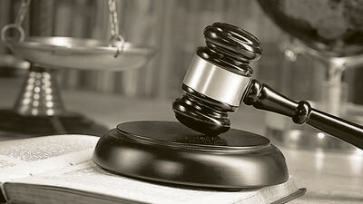 Judge`s gavel and law books.constitutional crisis (Shutterstock)