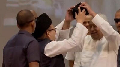 Bihar CM Nitish Kumar resisted with a smile and both hands as a Muslim community leader offered to put a cap on his head, at the state madrasa education board's function in Patna. (X/ANI) Bihar CM Nitish Kumar resisted with a smile and both hands as a Muslim community leader offered to put a cap on his head, at the state madrasa education board's function in Patna. (X/ANI)