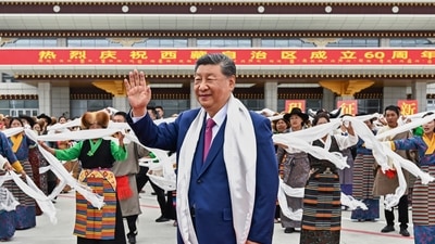In this photo released by Xinhua News Agency, Chinese President Xi Jinping waves as he arrives at Lhasa in Tibet on Wednesday (AP)