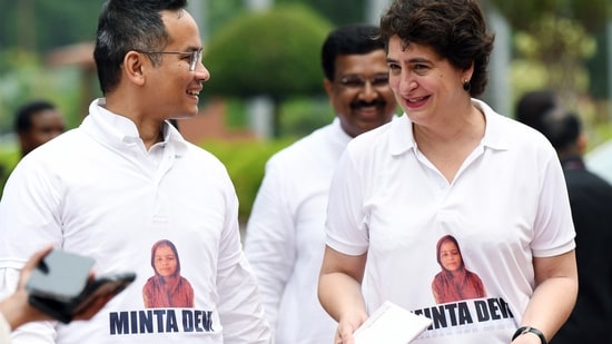 Congress MP Priyanka Gandhi Vadra and deputy leader of Congress in Lok Sabha Gaurav Gogoi in a t-shirt with a picture voter Minta Devi, who was allegedly listed as 124 years old by EC.(Rahul Singh/ANI)