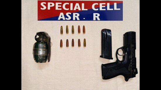 The hand grenade and pistol seized by Amritsar police.