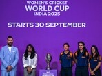 Indian team players Jemimah Rodrigues (R), Smriti Mandhana (2R) and Harmanpreet Kaur (C) pose with the trophy alongside former player Yuvraj Singh (L)
