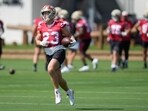 San Francisco 49ers running back Christian McCaffrey (23) runs during practice at the team's football training camp San Francisco 49ers running back Christian McCaffrey (23) runs during practice at the team's football training camp