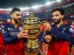 Virat Kohli and Rajat Patidar celebrate lifting the IPL 2025 trophy together. Virat Kohli and Rajat Patidar celebrate lifting the IPL 2025 trophy together.