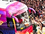 RCB fans mill around the bus carrying the championship-winning team to the Chinnaswamy Stadium in Bengaluru.