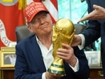 President Donald Trump holds the FIFA World Cup Winners Trophy during an announcement in the Oval Office President Donald Trump holds the FIFA World Cup Winners Trophy during an announcement in the Oval Office