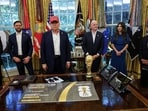 U.S. President Donald Trump stands with Vice President JD Vance, FIFA president Gianni Infantino and U.S. Homeland Security Secretary Kristi Noem, as President Trump makes an announcement on the 2026 FIFA World Cup, in the Oval Office at the White House in Washington, D.C., U.S., August 22, 2025. REUTERS/Jonathan Ernst