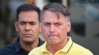 Brazil's federal police say in the new documents that Jair Bolsonaro and his son Eduardo used “several manoeuvres to dissimulate the origin and destination of financial resources. (AFP) Brazil's federal police say in the new documents that Jair Bolsonaro and his son Eduardo used “several manoeuvres to dissimulate the origin and destination of financial resources. (AFP)