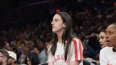 Caitlin Clark #22 of the Indiana Fever watches from the bench during the first half of the WNBA game against the Phoenix Mercury (Getty Images via AFP) Caitlin Clark #22 of the Indiana Fever watches from the bench during the first half of the WNBA game against the Phoenix Mercury (Getty Images via AFP)