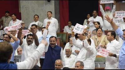 Congress MLAs protesting against the deteriorating law and order situation in Haryana on the opening day of the monsoon session of the assembly in Chandigarh on Friday. (Keshav Singh/HT) Congress MLAs protesting against the deteriorating law and order situation in Haryana on the opening day of the monsoon session of the assembly in Chandigarh on Friday. (Keshav Singh/HT)