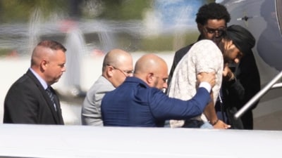 Harjinder Singh is escorted onto an airplane by Florida Lt. Gov. Jay Collins and law enforcement on Thursday in Stockton. (AP) Harjinder Singh is escorted onto an airplane by Florida Lt. Gov. Jay Collins and law enforcement on Thursday in Stockton. (AP)