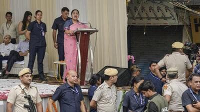 Delhi Chief Minister Rekha Gupta surrounded by security personnel at Ashok Bazar in Gandhi Nagar in New Delhi on Friday. (RAJ K RAJ /HT PHOTO)