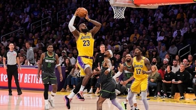 LeBron James (23) shoots as Minnesota Timberwolves guard Nickeil Alexander-Walker (9) defends (AP) LeBron James (23) shoots as Minnesota Timberwolves guard Nickeil Alexander-Walker (9) defends (AP)