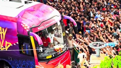 RCB fans mill around the bus carrying the championship-winning team to the Chinnaswamy Stadium in Bengaluru. (PTI) RCB fans mill around the bus carrying the championship-winning team to the Chinnaswamy Stadium in Bengaluru. (PTI)
