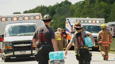 Rescue personnel work the scene of a tour bus that crashed and rolled over on the New York State Thruway near Pembroke (AP)