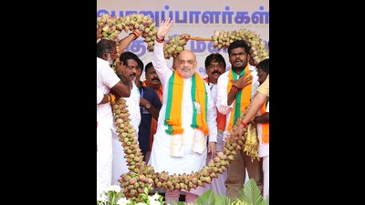 Union Home Minister Amit Shah being garlanded by BJP leaders during the 'Booth Karyakarta Sammelan', in Tirunelveli on Friday. (@AmitShahX) Union Home Minister Amit Shah being garlanded by BJP leaders during the 'Booth Karyakarta Sammelan', in Tirunelveli on Friday. (@AmitShahX)