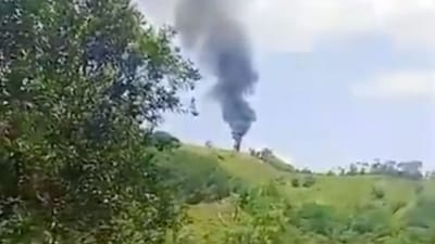 An image from a video posted by Antioquia’s provincial governor, Andrés Julián Rendón, on X shows smoke rising from the site where a Colombian police helicopter went down. An image from a video posted by Antioquia’s provincial governor, Andrés Julián Rendón, on X shows smoke rising from the site where a Colombian police helicopter went down.