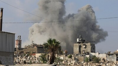 Smoke rises following an Israeli strike, in Gaza City, August 22 (REUTERS)