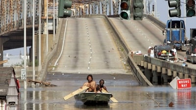 Two men paddle in high water after Hurricane Katrina devastated the area on August 31, 2005 in New Orleans, Louisiana. (AFP FILE) Two men paddle in high water after Hurricane Katrina devastated the area on August 31, 2005 in New Orleans, Louisiana. (AFP FILE)