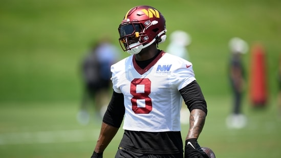 Washington Commanders running back Brian Robinson Jr. (8) works out during practice at NFL football minicamp (AP)