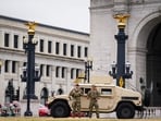 Members of the National Guard stand near a Humvee outside of Union Station