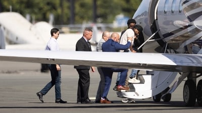 Harjinder Singh was escorted onto an airplane by Florida Lt. Gov. Jay Collins and law enforcement officers on Thursday in Stockton. (AP) Harjinder Singh was escorted onto an airplane by Florida Lt. Gov. Jay Collins and law enforcement officers on Thursday in Stockton. (AP)