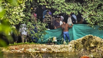 A Special Investigation Team (SIT) is examining the site in the Dharmasthala mass burial case in the Dakshina Kannada district of Karnataka. (PTI) A Special Investigation Team (SIT) is examining the site in the Dharmasthala mass burial case in the Dakshina Kannada district of Karnataka. (PTI)