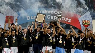 NorthEast United FC's players celebrate with the trophy after winning the Durand Cup 2025. (PTI)