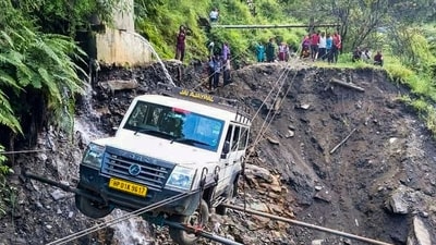A vehicle being lifted from the debris of a damaged road after heavy rainfall, in Kullu district, Himachal Pradesh on Saturday, August 23, 2025. (PTI) A vehicle being lifted from the debris of a damaged road after heavy rainfall, in Kullu district, Himachal Pradesh on Saturday, August 23, 2025. (PTI)