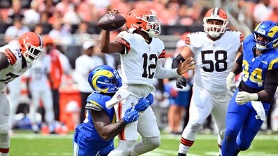 Linebacker Jamil Muhammad #45 of the Los Angeles Rams sacks quarterback Shedeur Sanders #12 (Getty Images via AFP)