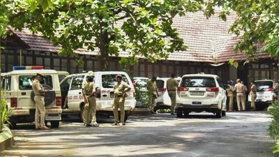 Police personnel at the office of the SIT constituted to probe the case related to the alleged mass burial in Dharmasthala of Dakshina Kannada district. (PTI file)