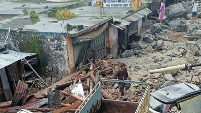 A man is seen making his way through debris after a cloudburst damaged several structures in Tharali, Chamoli, on the intervening night of Friday and Saturday. Uttarakhand remains under an orange alert, with the India Meteorological Department (IMD) forecasting thunderstorms, lightning, and very heavy rain in parts of the state. (HT Photo) A man is seen making his way through debris after a cloudburst damaged several structures in Tharali, Chamoli, on the intervening night of Friday and Saturday. Uttarakhand remains under an orange alert, with the India Meteorological Department (IMD) forecasting thunderstorms, lightning, and very heavy rain in parts of the state. (HT Photo)