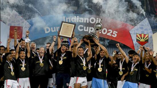 NorthEast United FC's players celebrate with the trophy after winning the Durand Cup 2025. (PTI)