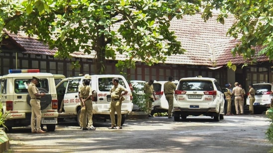 Police personnel at the office of the SIT constituted to probe the case related to the alleged mass burial in Dharmasthala of Dakshina Kannada district, in Mangaluru, (PTI)