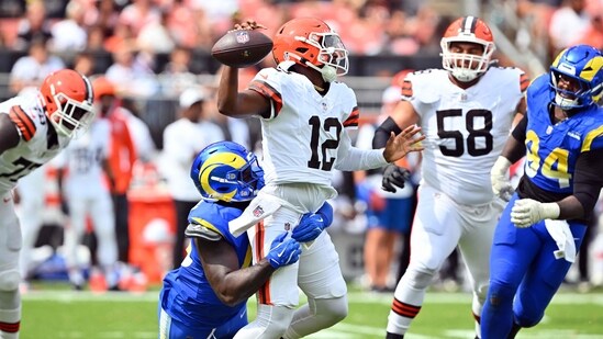 Linebacker Jamil Muhammad #45 of the Los Angeles Rams sacks quarterback Shedeur Sanders #12 (Getty Images via AFP)