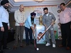 Anandpur Sahib MP Malvinder Singh Kang and actor Jimmy Shergill during trophy unveiling in Chandigarh on Saturday. (HT Photo)