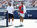 Carlos Alcaraz of Spain with his brother Alvaro Alcaraz as he walks to takes a break during a practice session ahead of the US Open Carlos Alcaraz of Spain with his brother Alvaro Alcaraz as he walks to takes a break during a practice session ahead of the US Open