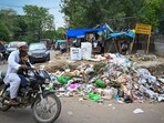 Garbage on the road in Taimoor Nagar in south Delhi on August 21. The city has a 27.5% gap between the waste it produces and processes; and so, cannot imagine a life without dhalaos. (Sanchit Khanna/HT Photo) Garbage on the road in Taimoor Nagar in south Delhi on August 21. The city has a 27.5% gap between the waste it produces and processes; and so, cannot imagine a life without dhalaos. (Sanchit Khanna/HT Photo)