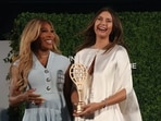 Five-time singles major champion Maria Sharapova shares a laugh with tennis great Serena Williams during her induction into the International Tennis Hall of Fame.