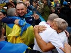 Olha embraces her son Yevhen, a freed Ukrainian prisoner of war (POW), as he left a bus after a swap, amid Russia's attack on Ukraine, in an undisclosed location in Ukraine on August 24, 2025.