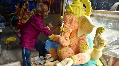 An artisan uses coloured chalk sticks to make the idol of Ganpati at a workshop in Chinchpokli in Mumbai, ahead of the Ganesh Chaturthi celebrations starting August 27. (Bhushan Koyande/Hindustan Times)