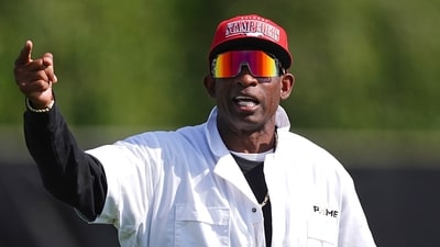 Colorado head coach Deion Sanders directs players during an NCAA college football practice Thursday, Aug. 14. (AP) Colorado head coach Deion Sanders directs players during an NCAA college football practice Thursday, Aug. 14. (AP)