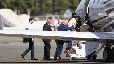 Harjinder Singh is escorted onto an airplane by law enforcement officials in Stockton, California. (AP) Harjinder Singh is escorted onto an airplane by law enforcement officials in Stockton, California. (AP)