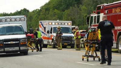 Rescue personnel work the scene of a tour bus that crashed and rolled over on the New York State Thruway near Pembroke, N.Y., Friday, Aug. 22, 2025. (AP) Rescue personnel work the scene of a tour bus that crashed and rolled over on the New York State Thruway near Pembroke, N.Y., Friday, Aug. 22, 2025. (AP)